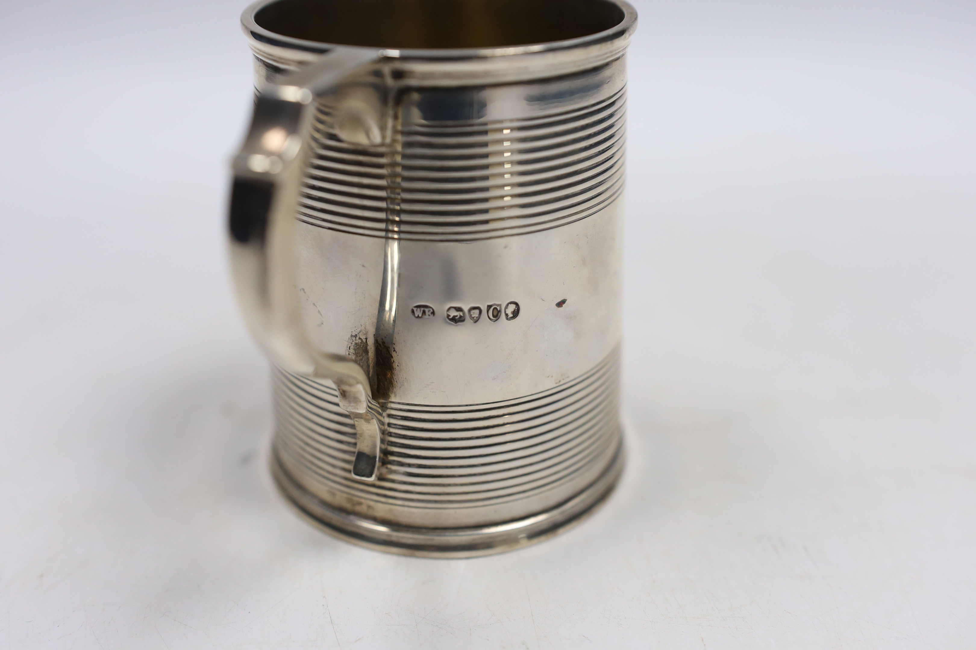 A Victorian reeded silver christening mug, William Evans, London, 1878, 87mm.